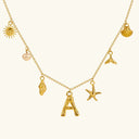 Noelle Initial Necklace with Sea Charms in 18k gold plated stainless steel