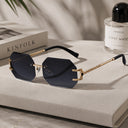 Cannes rimless rectangle sunglasses with gold temples and grey gradient lenses, view 2