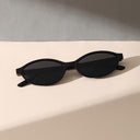 Capri oval sunglasses with a retro frame and tinted lenses, view 9