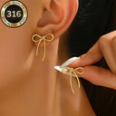 Gold Bow Earrings with Ribbon Tails, Waterproof Bow Stud Earrings, Hypoallergenic 316L Steel | Marliva