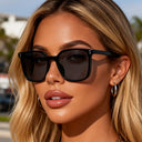 Marbella bold square sunglasses with a black frame and grey lenses, view 2