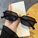 Mykonos small rectangle sunglasses with a black frame and dark lenses, view 3