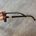 Mykonos small rectangle sunglasses with a black frame and dark lenses, view 7