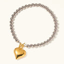 Odalie Two-Tone Heart Necklace in gold and silver tone stainless steel