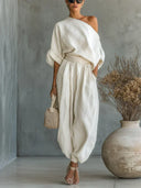 Sinead white two-piece set with off-the-shoulder top and tapered pants