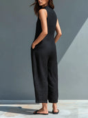 Stevie black sleeveless jumpsuit with mandarin collar and button front, view 2