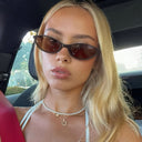 Capri oval sunglasses with a retro frame and tinted lenses, view 4