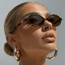 Sorrento small oval sunglasses with a tortoiseshell frame and brown lenses, view 5