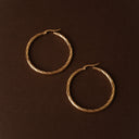 Renata Large Gold Twisted Statement Hoop Earrings, view 3