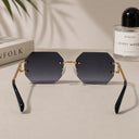 Cannes rimless rectangle sunglasses with gold temples and grey gradient lenses, view 3