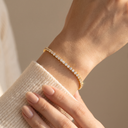 Siena gold tennis bracelet worn on the wrist