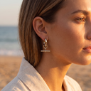 Remi silver T-bar hoop earring worn on the ear