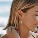 Renata Large Gold Twisted Statement Hoop Earrings, view 2