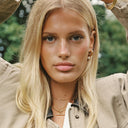 Model wearing a gold T-bar rope chain necklace